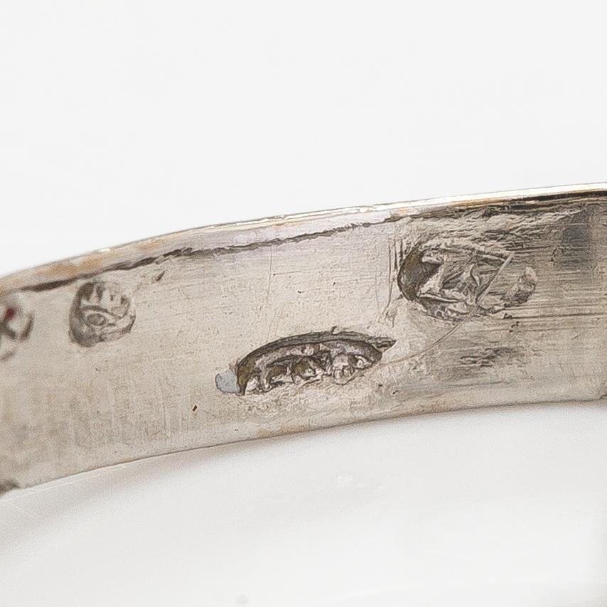 An 18K white gold ring with diamonds ca. 0.24 ct in total and a sapphire. Finnish import marks.