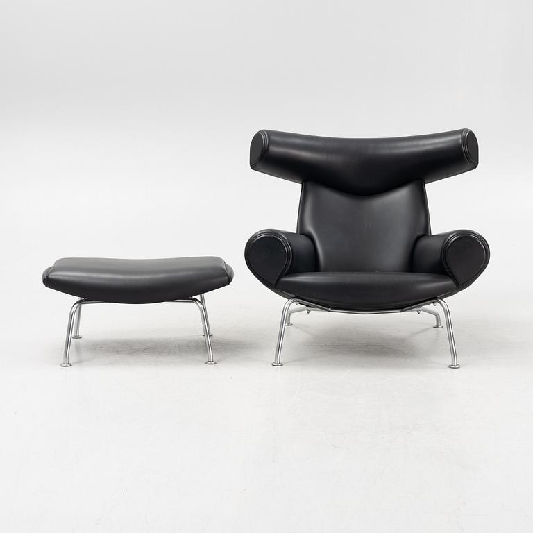 Hans J Wegner, an 'Ox Chair' and an ottoman, for Erik Jørgensen, Denmark, 2005 and 2010.