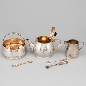 A Russian early 20th century parcel-gilt silver 5 piece tea-set, mark of Grachev, St. Petersburg 1908-1917.