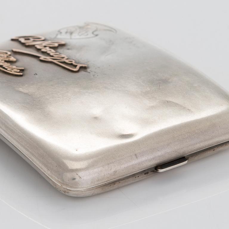 Two silver cigarette cases, J. H. Werner, Berlin, 1922, and Huguenin Frères, Switzerland before 1933.