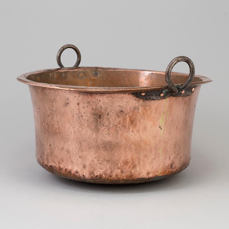 A 19th century copper cauldron.