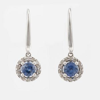 A pair of 18K gold earrings with faceted sapphires and round brilliant-cut diamonds.