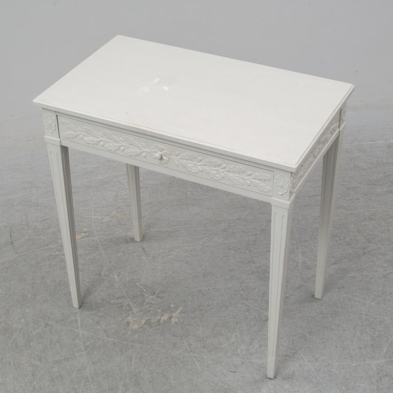 A late Gustavian style table with a drawer from around year 1900.