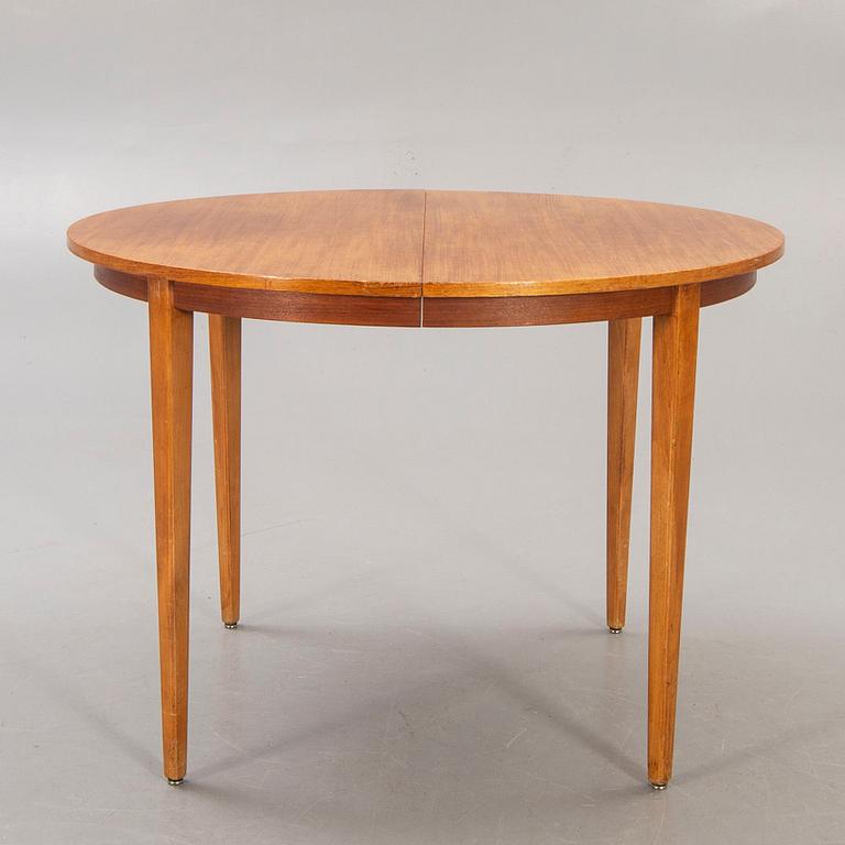 A 1960s teak dining table.