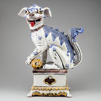 A large Chinese ceramic tile sculpture of a buddhist lion, 20th century.