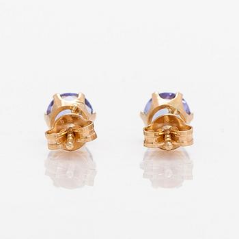 A pair of 14K gold earrings with tanzanites.