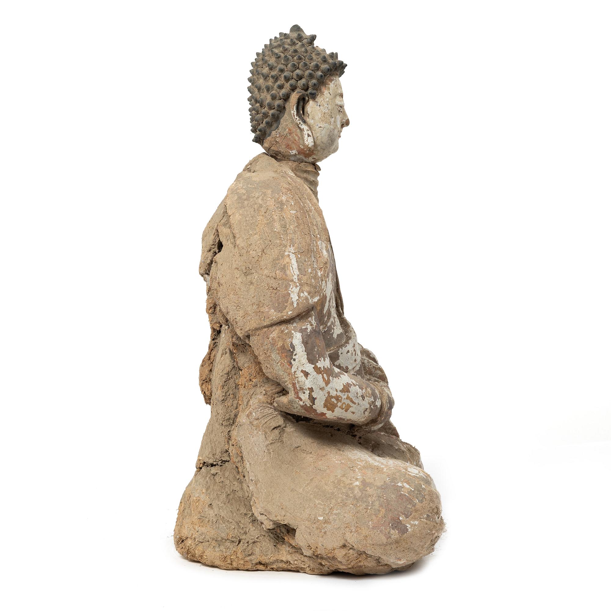 A Southeast Asian figure of a Buddha, 20th century.