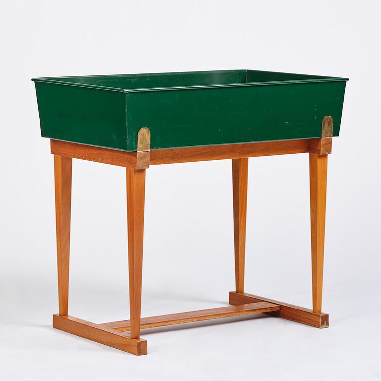 Josef Frank, a rare flower table with green lacquered box model B 2084, Firma Svenskt Tenn, 1950-60s.