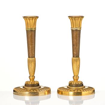 A pair of Empire candelsticks.