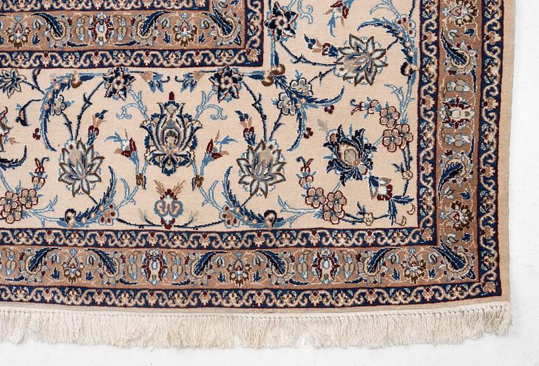 A Nain part silk carpet, c. 535 x 340 cm.