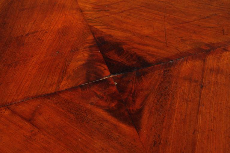 A late 19th century table with two extension leaves.