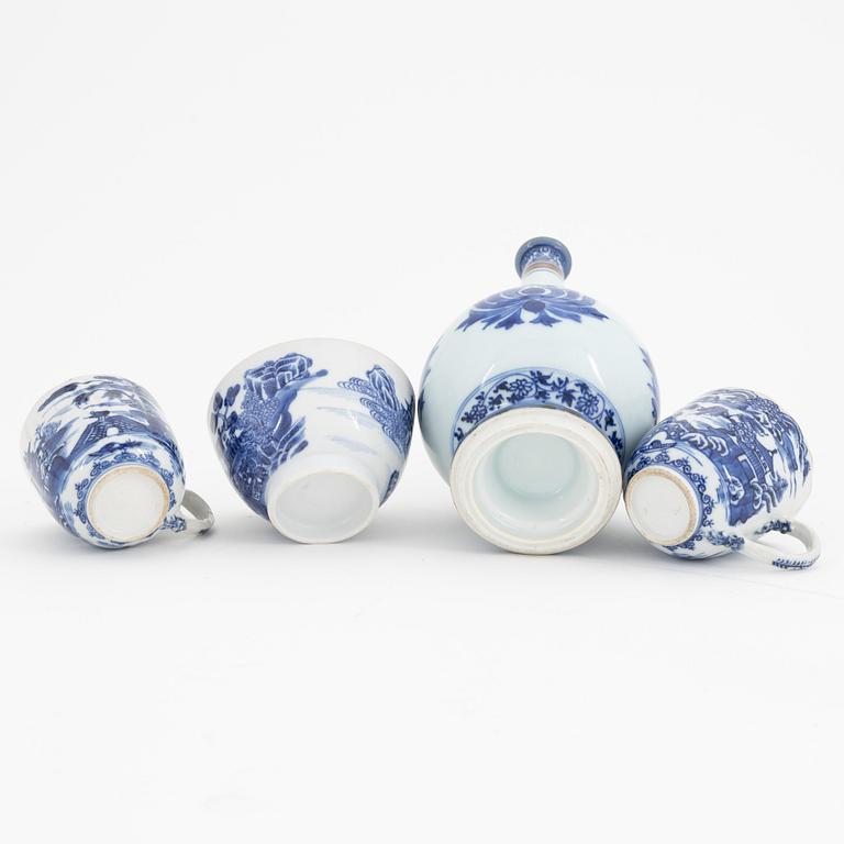 A group of Chinese blue and white porcelain: dish, vase, three cups and two plates. 18th and 20th century.