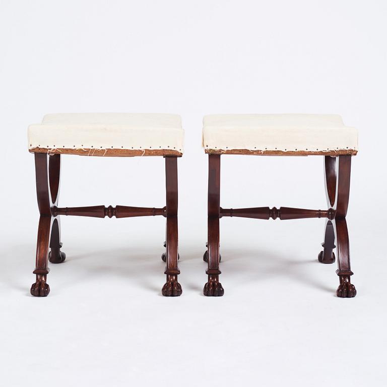 A pair of Directoire mahogany stools, circa 1800.