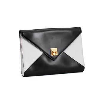 607. CÉLINE, a black and white leather clutch.