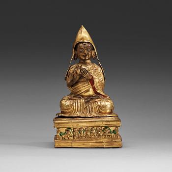 16. A Mongolian repousse gilt copper figure of Tsong Kapa, 18th Century.