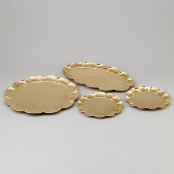 A set of four brass plates by Ture Henrikson, Arvika.