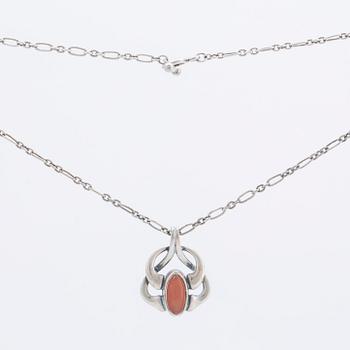 A silver and moonstone jewellery set consisting of necklace and earrings by Georg Jensen, jewellery of the year 2006.