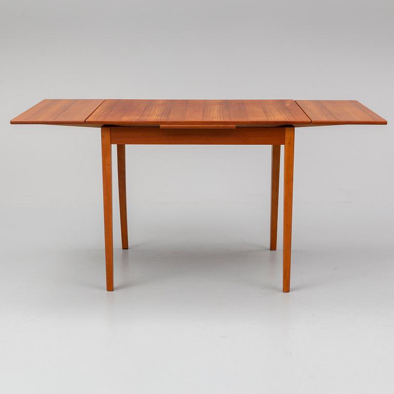 A 1950/60s teak veneered table.