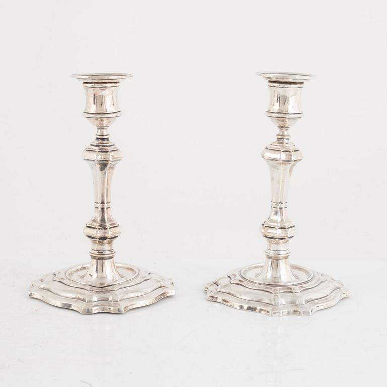 A pair of silver candlesticks, makr of William Hutton & Sons Ltd, London, 1900.