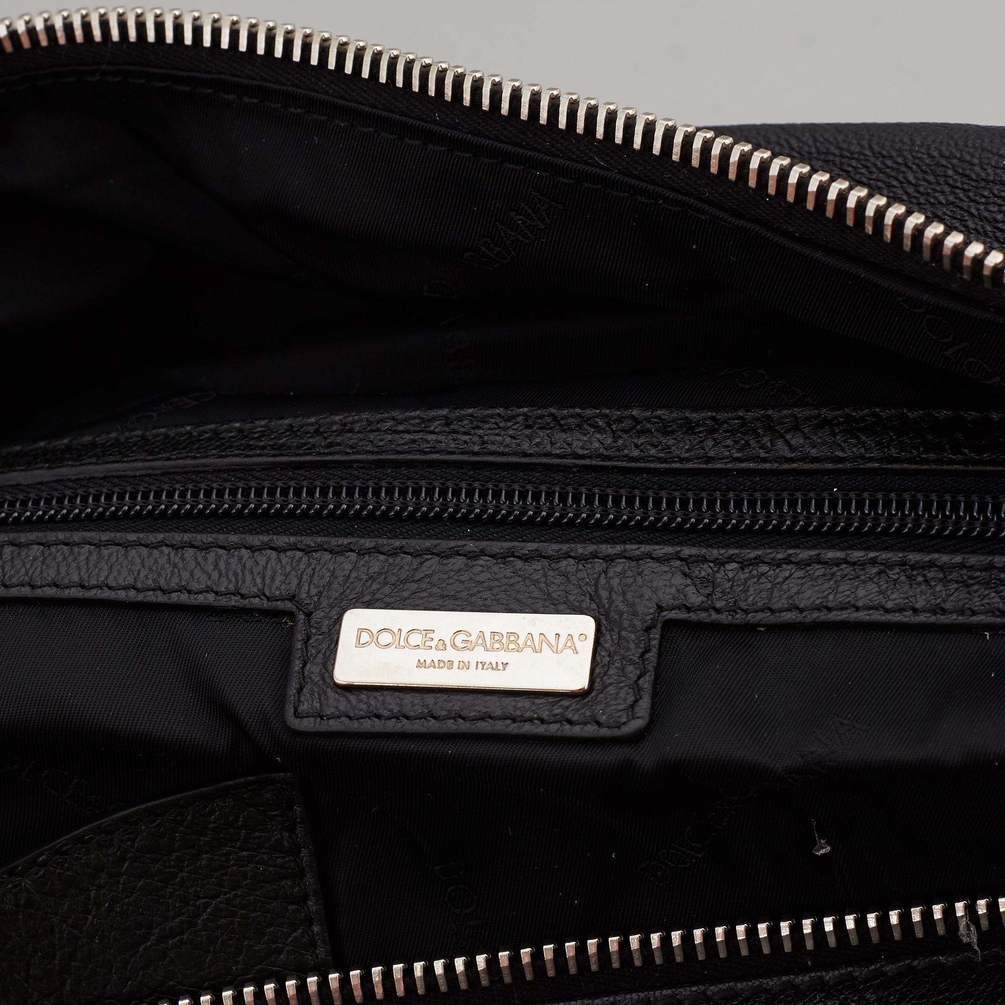 DOLCE & GABBANA, a black leather weekend bag, 2009.