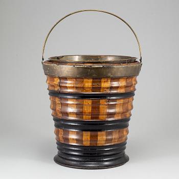 A 19th century brass and wood wine cooler.