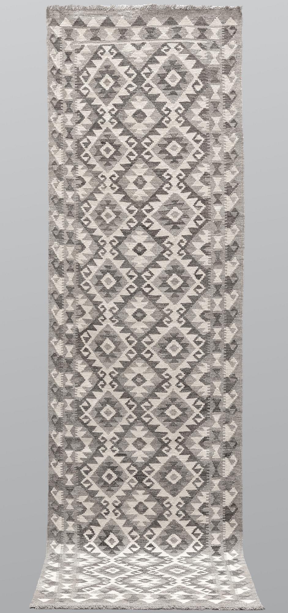 A runner, kilim, ca 298 x 84 cm.