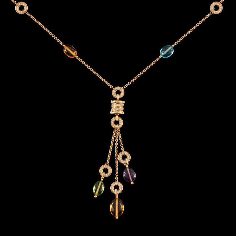 A pendant necklace in 18K yellow gold with peridot, amethyst, blue topaz, citrine quartz and pavé diamonds.