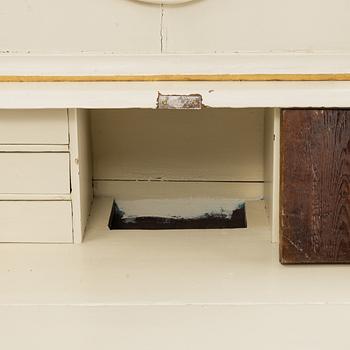 A 19th century painted cabinet with clock.