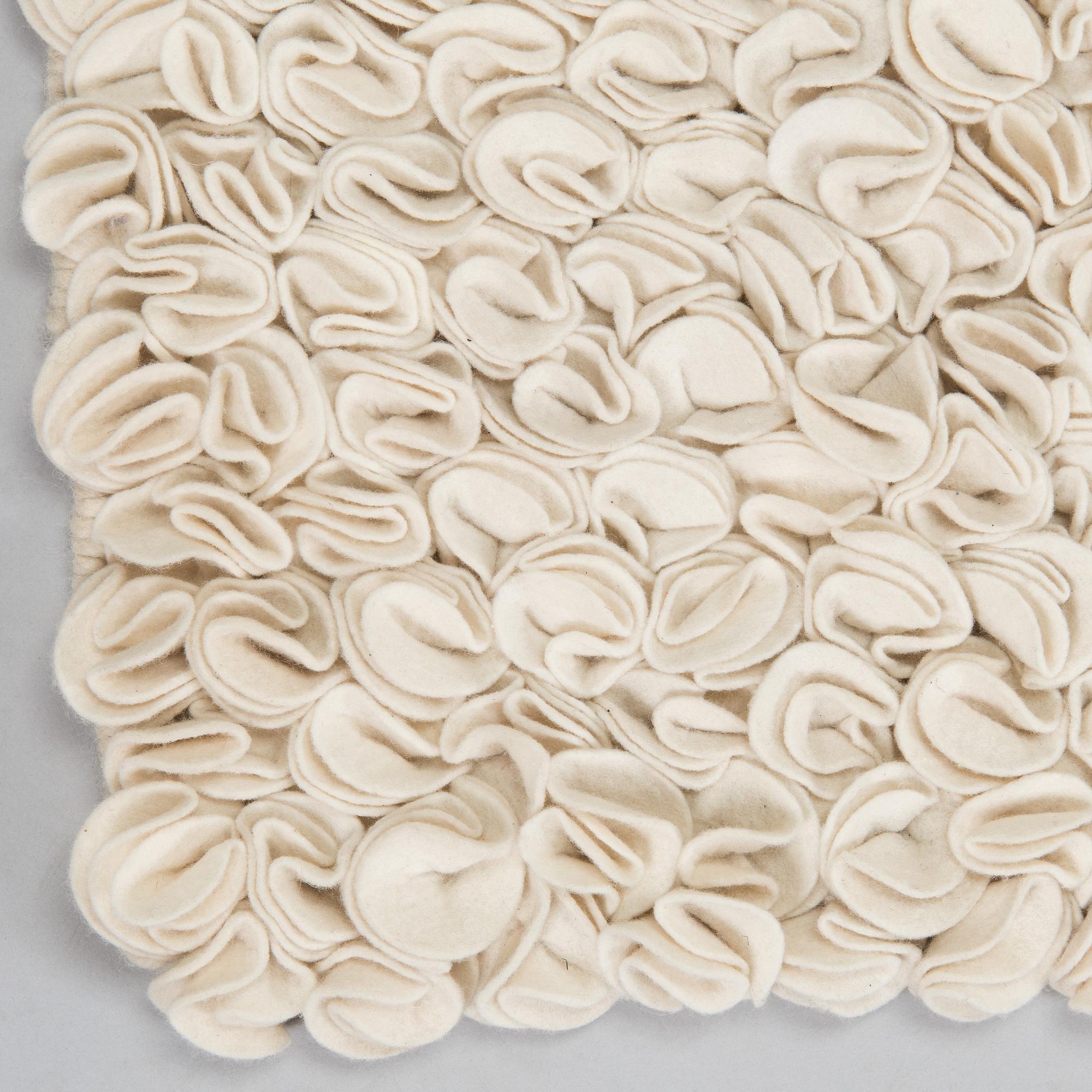 A wool carpet, Nanimarquina, circa 151 x 153 cm.