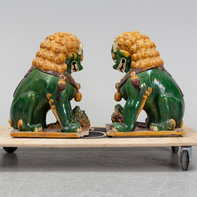 A pair of sancai-glazed chinese buddhist lions or guardian lions, early 20th century.