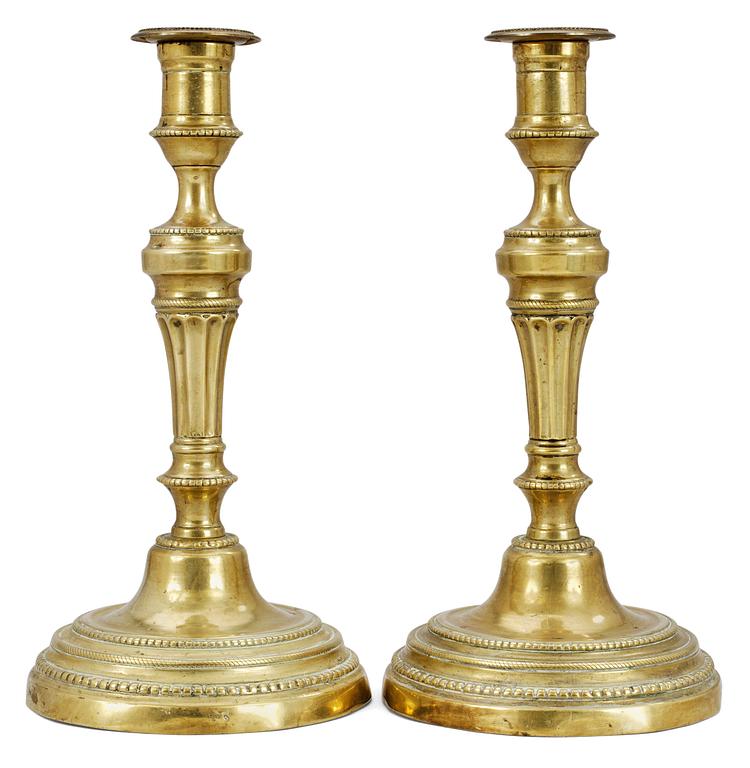 A pair of French Louis XVI candlesticks.