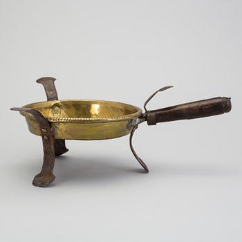 An 18th century brass brazier.