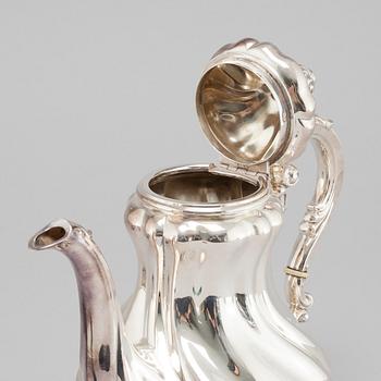 A silver coffee pot, creamer and sugar bowl with swedish import marks, 1930s.