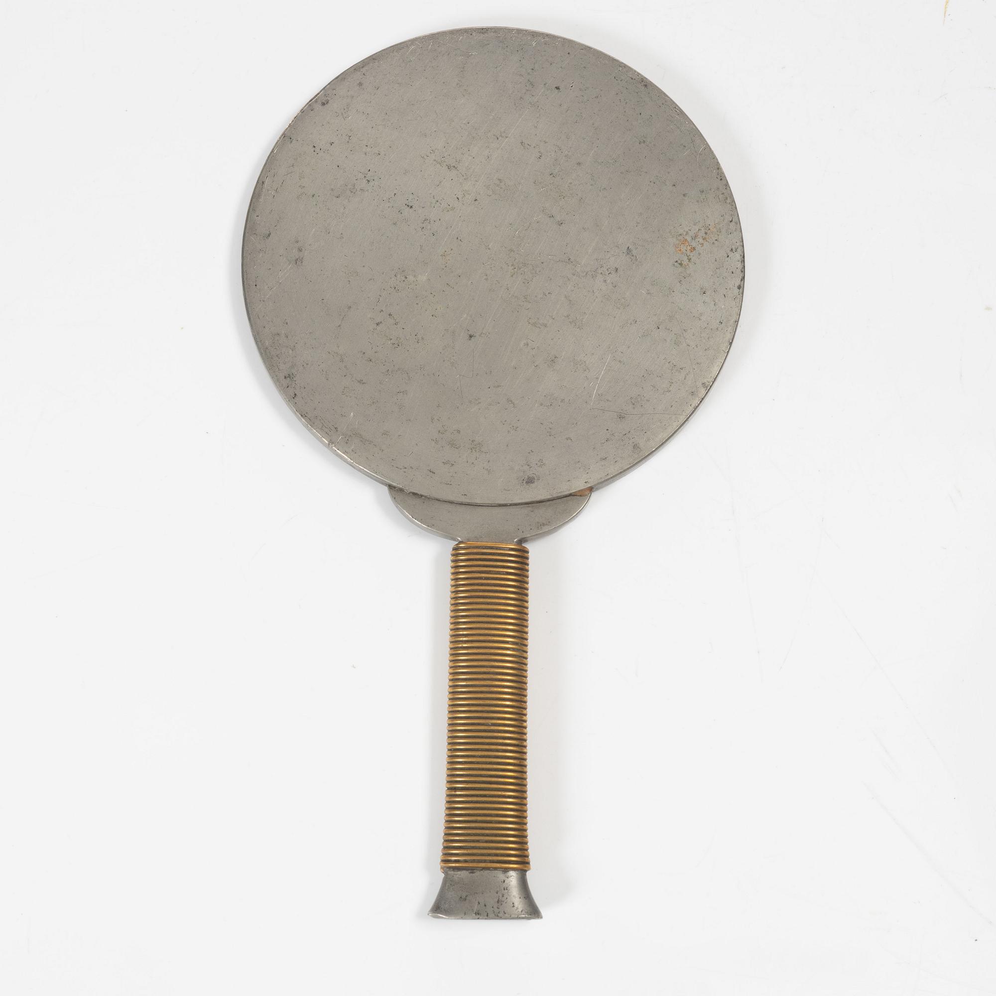 Estrid Ericson & Björn Trägårdh, a pewter and brass hand mirror model A 1444, Svenskt Tenn, Sweden 1930s-40s.