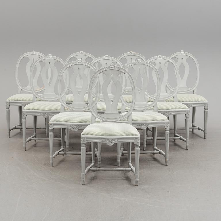 A Gustavian style dining table and ten chairs, 20th century.