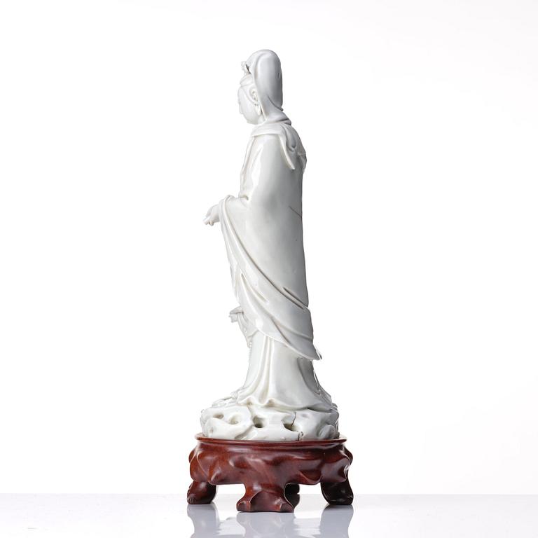 A blanc de chine figure of Guanyin and a servant, Qing dynasty, 19th Century.