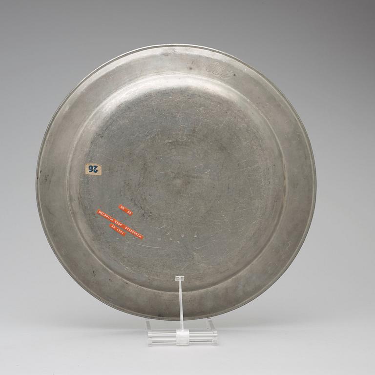 A pewter charger by M Beck 1741.