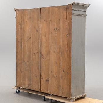 A mid 19th century painted wardrobe.