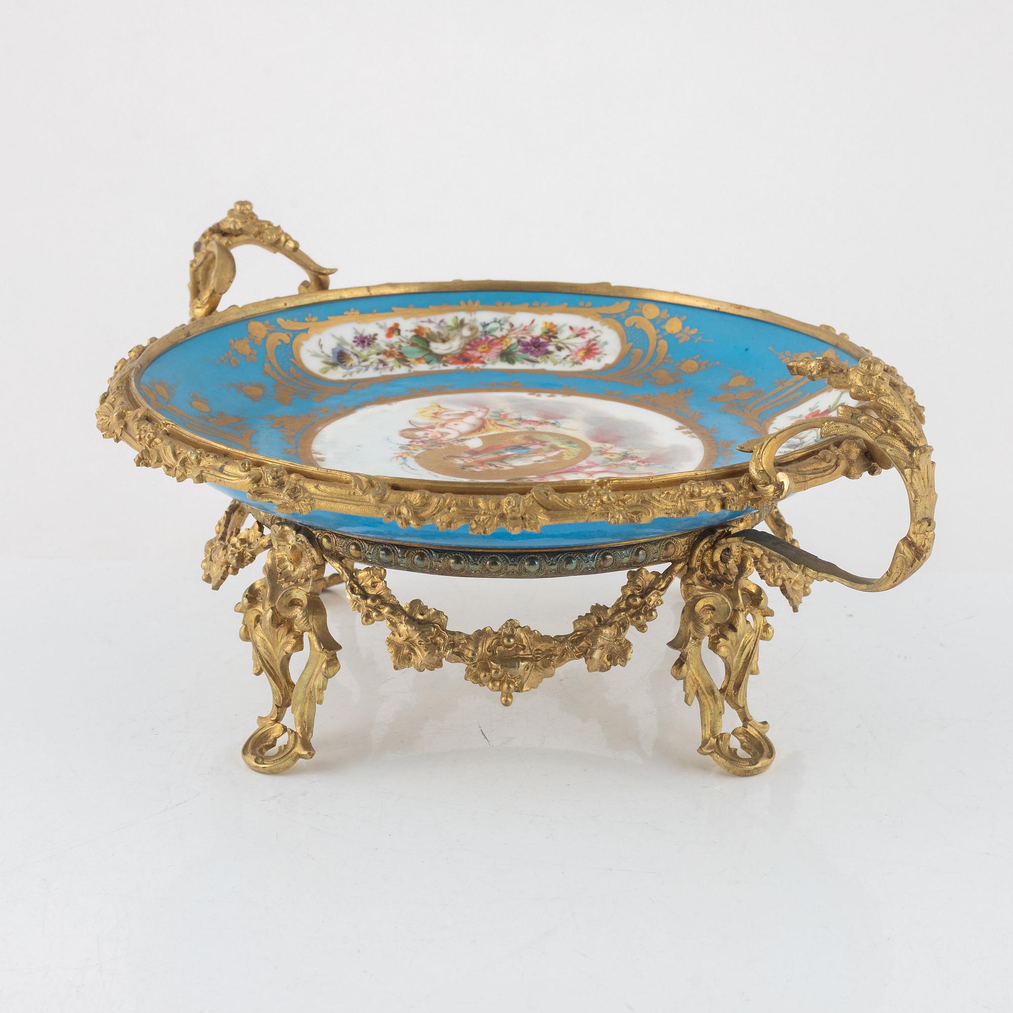 A French porcelain and brass centrepiece, second half of the 19th Century.