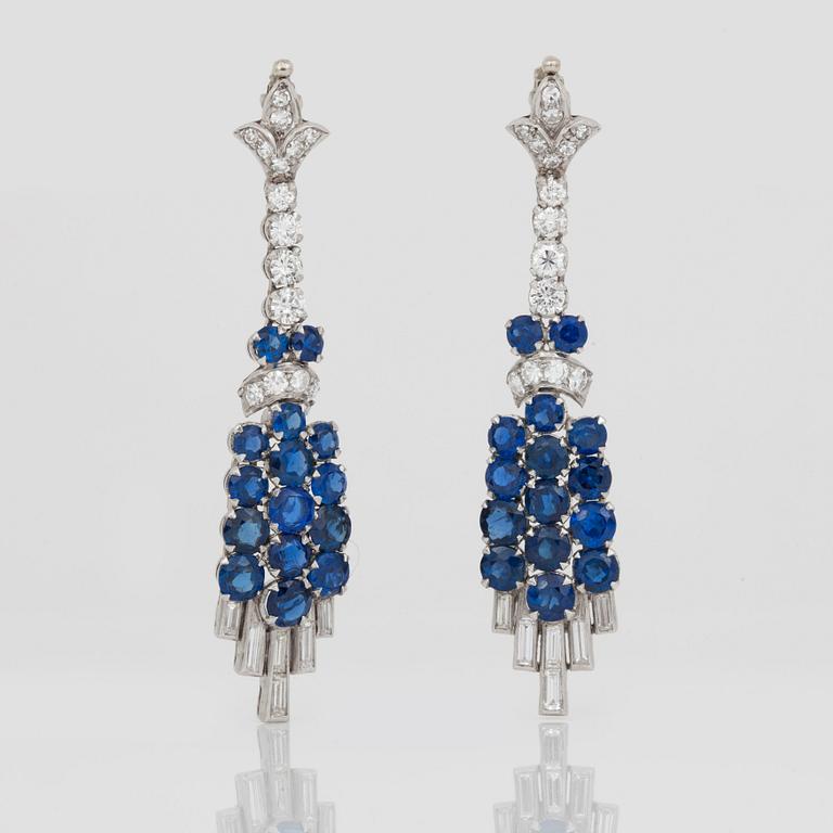 A diamond and sapphire set, probably Garrard & co. The set can be worn as a necklace, earrings, double clip or brooch.