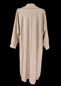 A beige wool coat by Yves Saint Laurent.