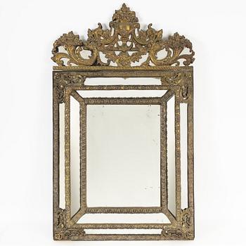 A Baroque style repoussé mirror, circa 1900.