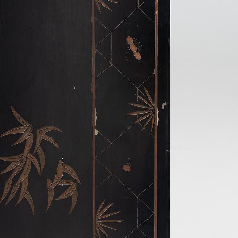 A Chinese lacquer folding screen, 20th century.