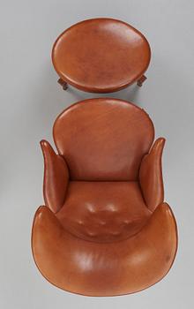 Frits Henningsen, an oak highback chair and ottoman, Denmark 1940's.