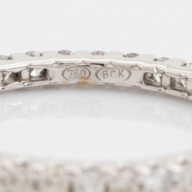 Brilliant-cut diamond eternity ring.