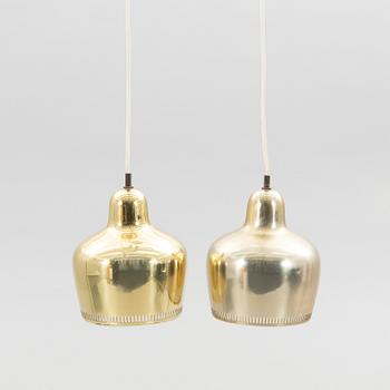 Alvar Aalto, a pair of "Golden Bell" brass pendant lamps, for Artek, Finland, model "A330S".