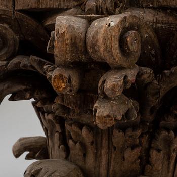 An 18th century carved wood corinthian capital.