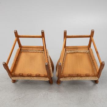 Henning Kjærnulf, a pair of oak 'Razorblade' armchairs with new sheepskin upholstery, from EGK, Demark, 1960s.