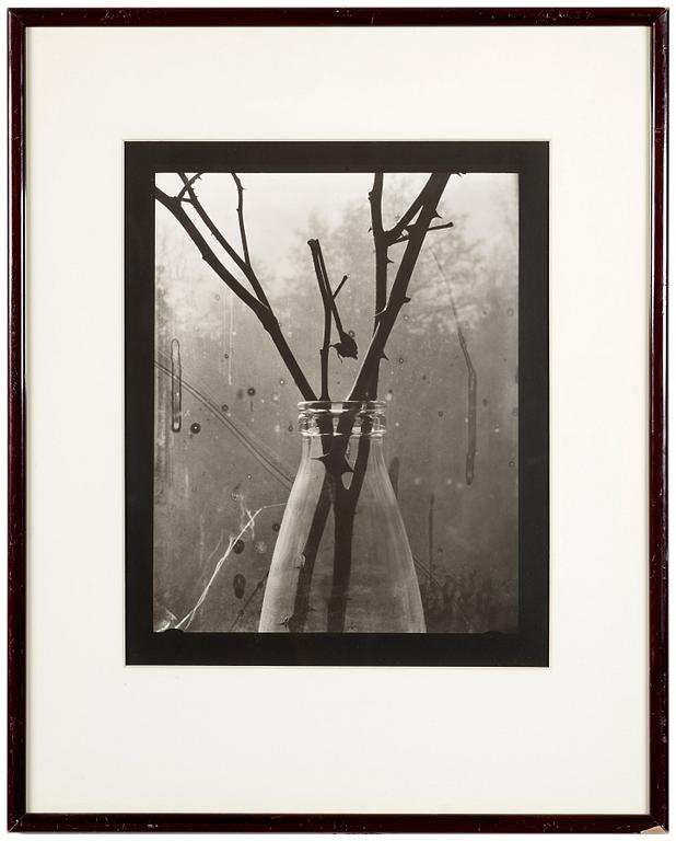 A gelatin silver photograph by GUNNAR SMOLIANSKY, signed and dated 1981 on verso.