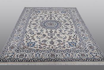 A carpet Nain, part silk, ca 290 x 196 cm.